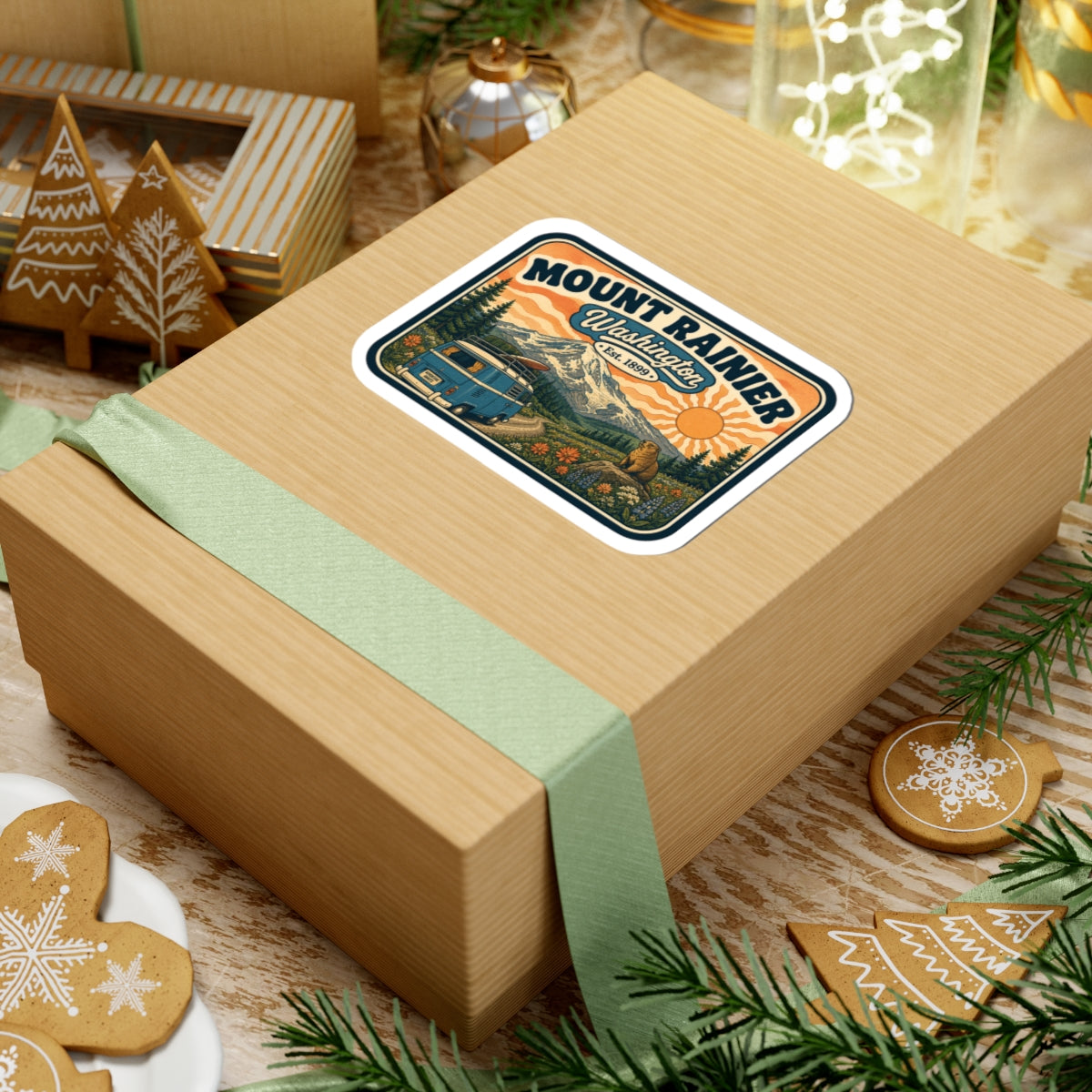 Mount Rainier sticker on wrapped gift, camper van landscape with pine trees and bear