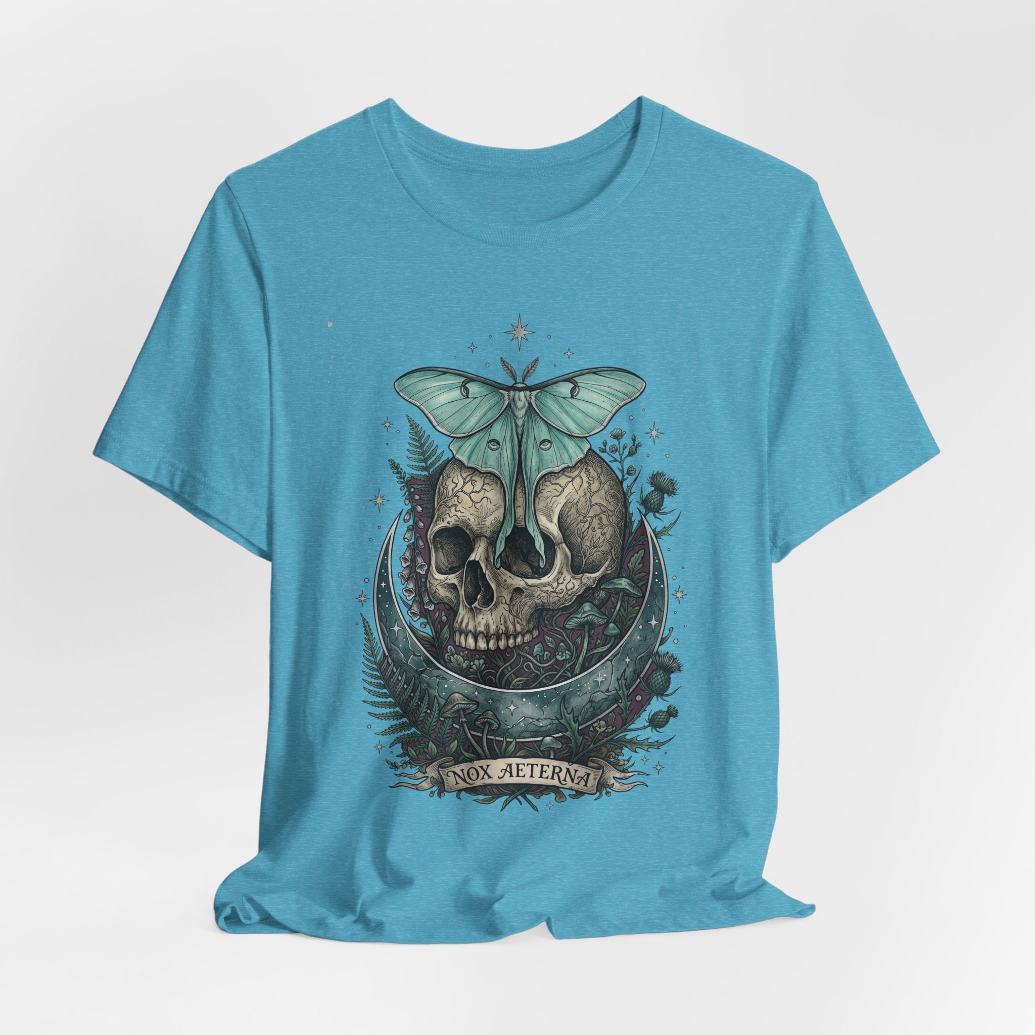 Light blue unisex T-shirt, front print of teal moth above a skull medallion