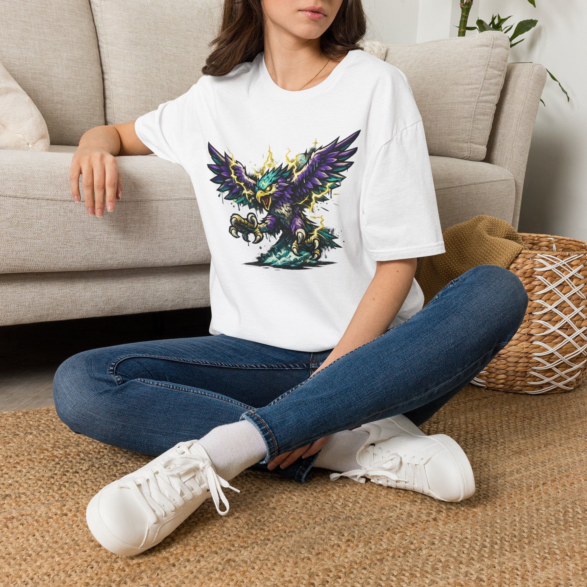 White crewneck t-shirt with colorful lightning thunderbird graphic, worn on model.