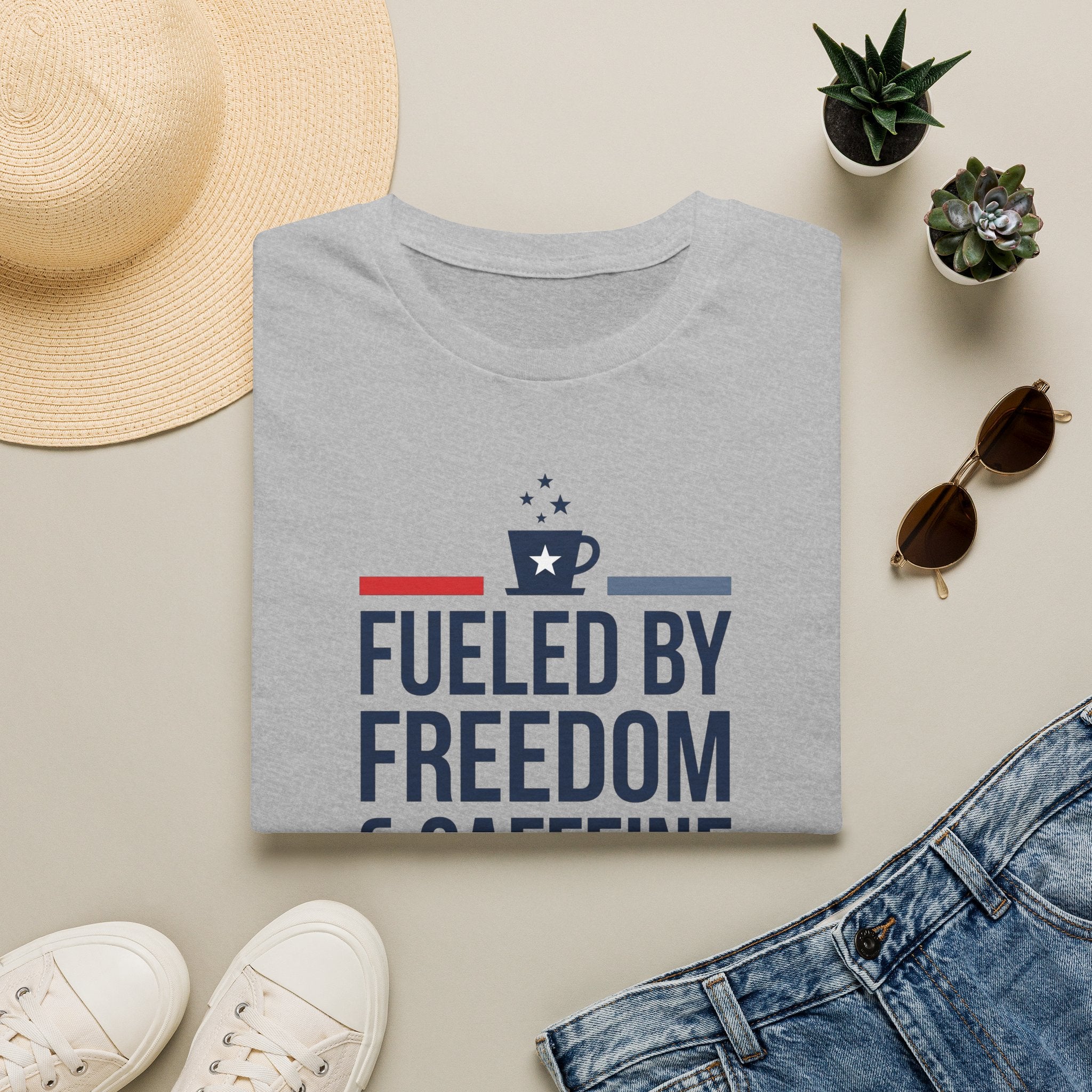 Light gray unisex crew-neck T-shirt with front graphic reading “Fueled by Freedom”