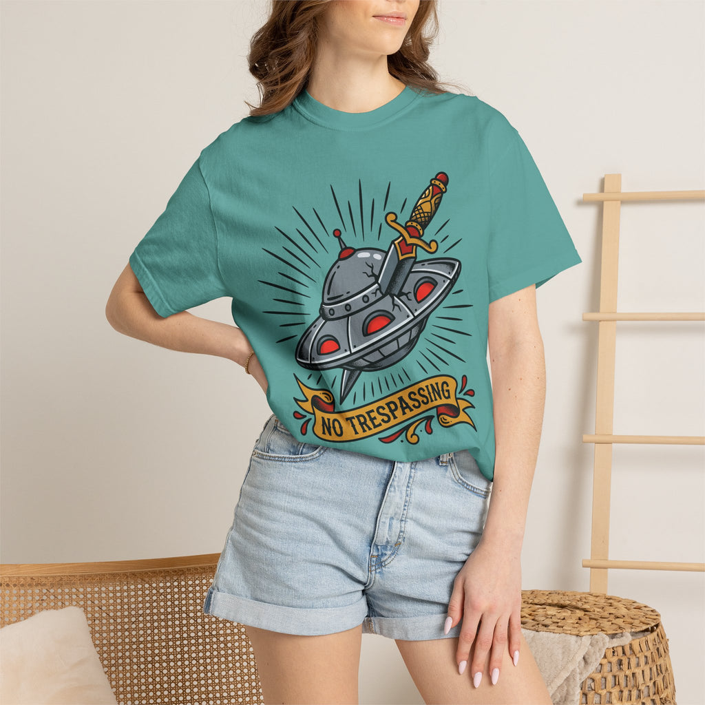 Teal T-shirt with UFO and dagger graphic and “No Trespassing” text