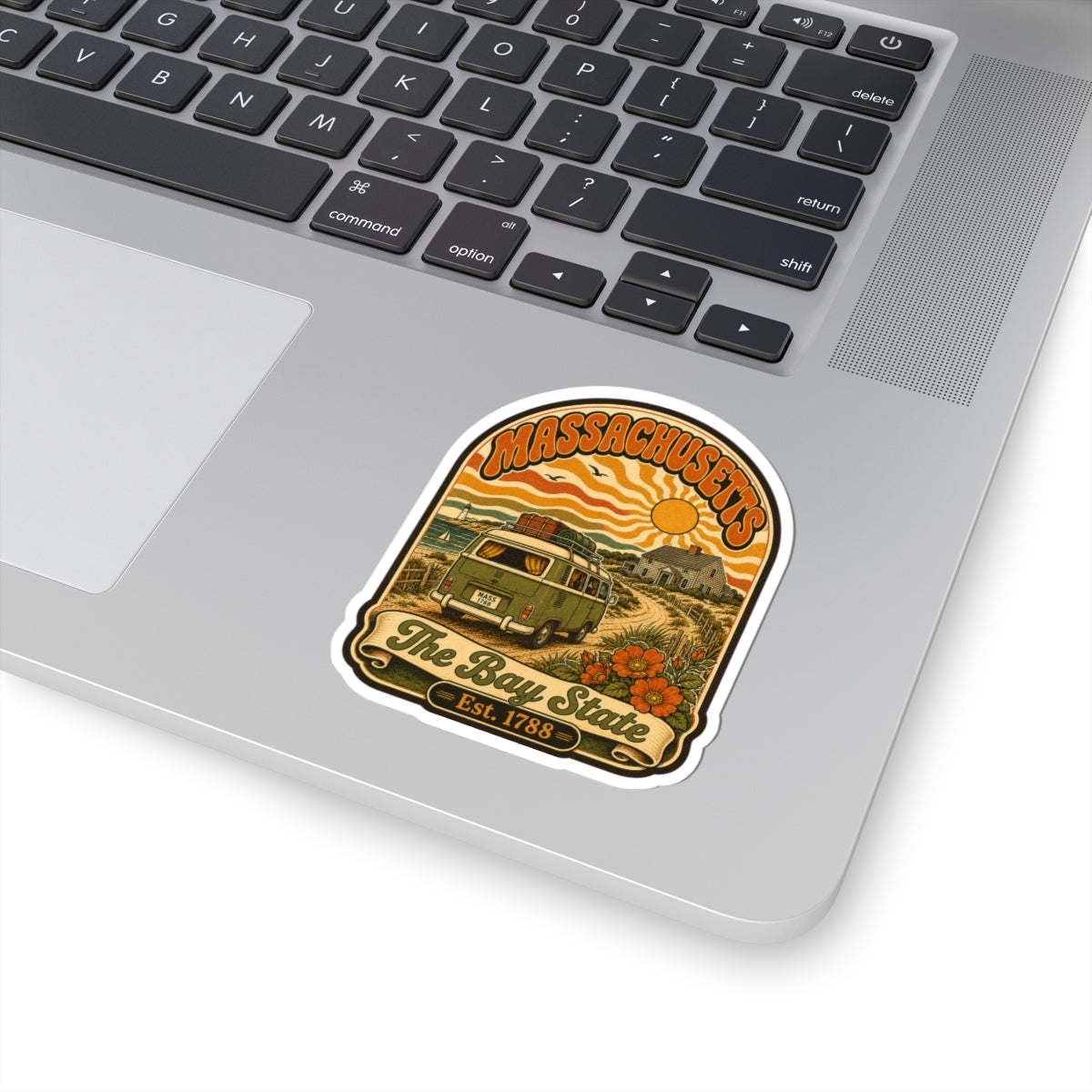 Massachusetts vintage van sticker placed on laptop surface, kiss-cut border