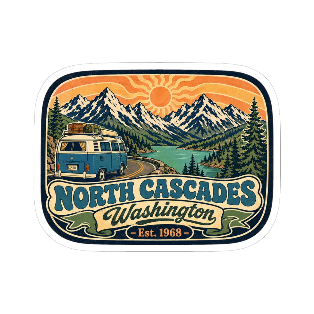 North Cascades decal sticker with blue camper van, mountain peaks, trees, and sun
