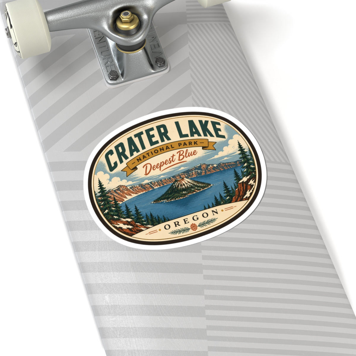 Round travel sticker on a skateboard deck showing Crater Lake “Deepest Blue” and “Oregon”.