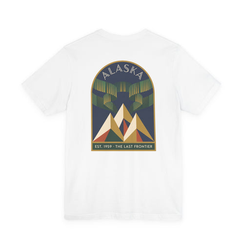 White graphic T-shirt with Alaska aurora badge and mountain design