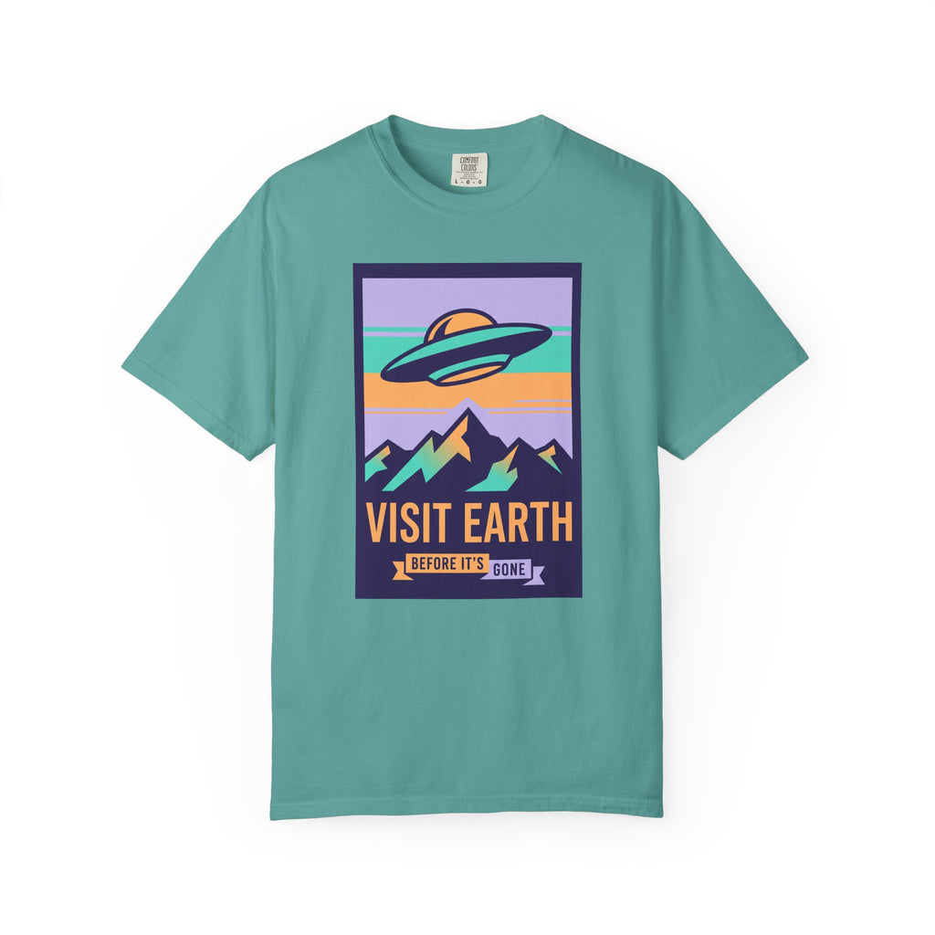 T-shirt with 'Visit Earth' UFO over mountains graphic, teal
