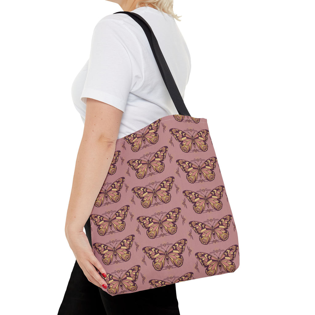 Pink tote bag with vintage butterfly print and black shoulder strap