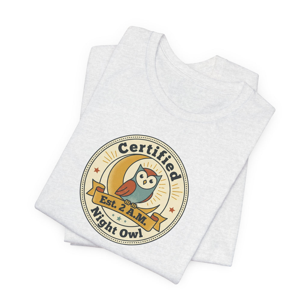 Light gray graphic T-shirt, crew neck, “Certified Night Owl” badge front print