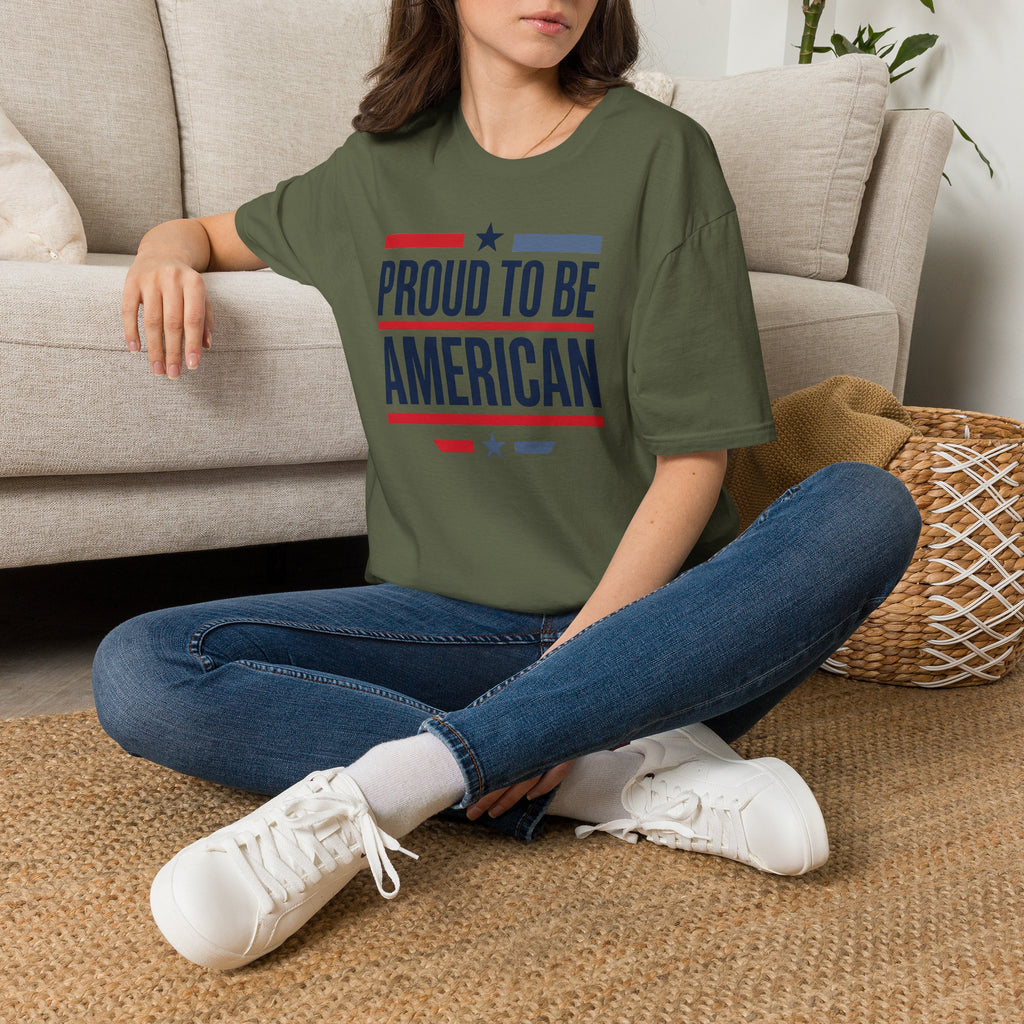Olive green T-shirt with “PROUD TO BE AMERICAN” flag-style text graphic.