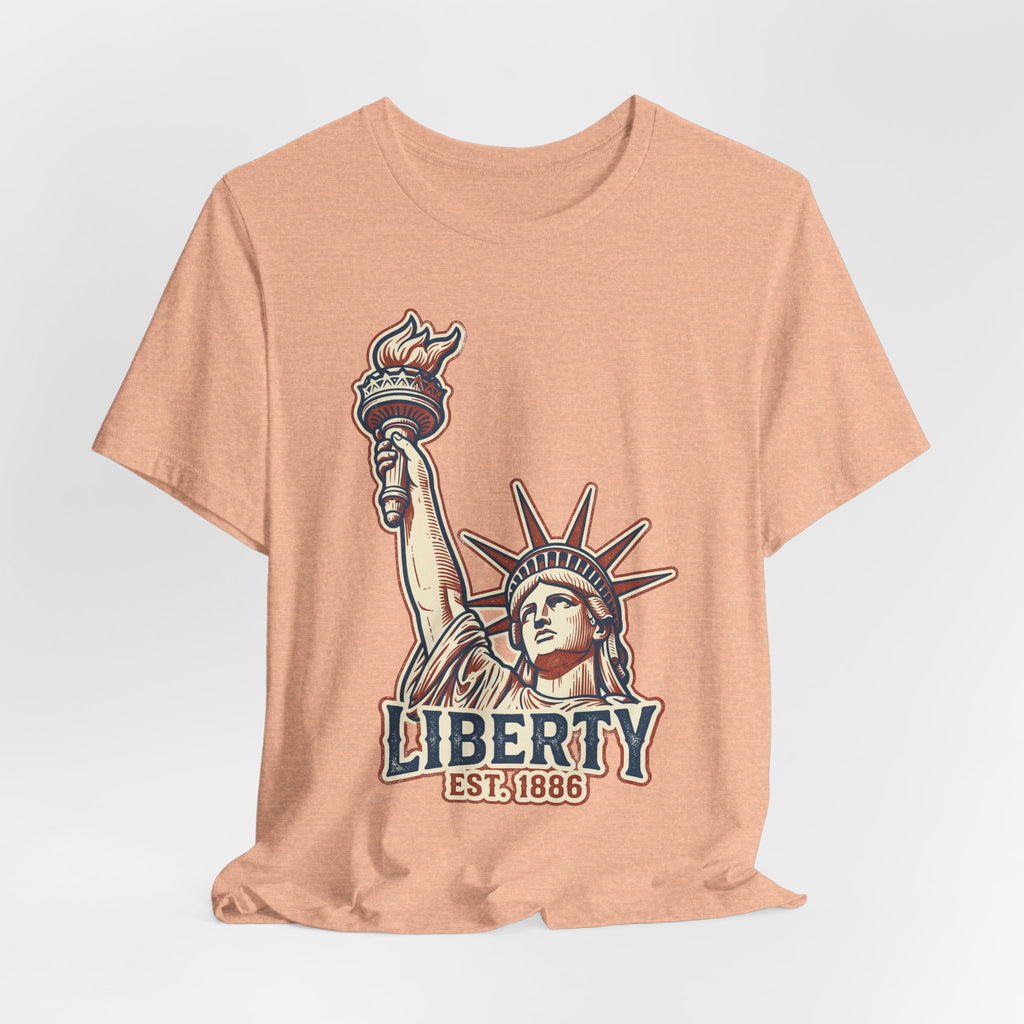 Peach graphic T-shirt with Statue of Liberty, "LIBERTY" and "EST.1886"