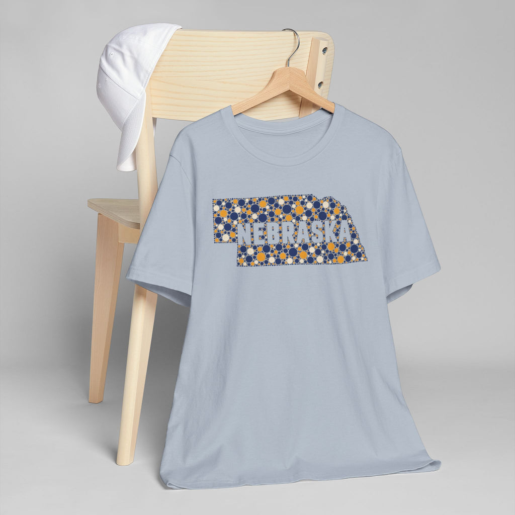 Light blue Nebraska graphic T-shirt with colorful state outline logo on front