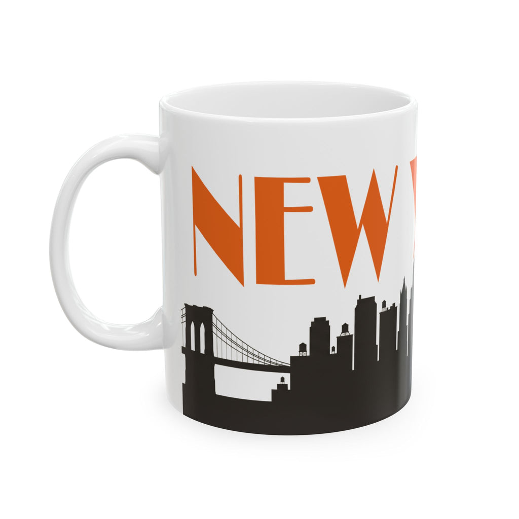 White ceramic coffee mug with orange “NEW” text and black city skyline