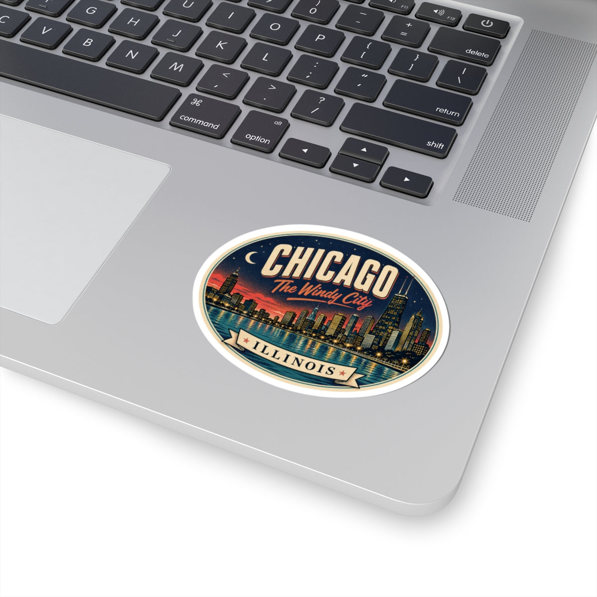 Round Chicago Illinois luggage tag sticker on laptop trackpad area, Windy City skyline text
