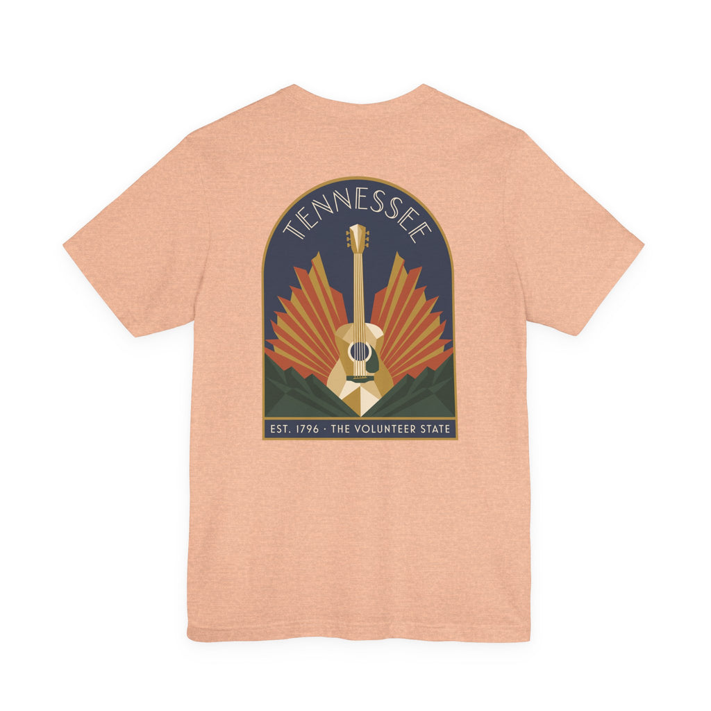 Light peach crew-neck T-shirt with Tennessee guitar art graphic on chest