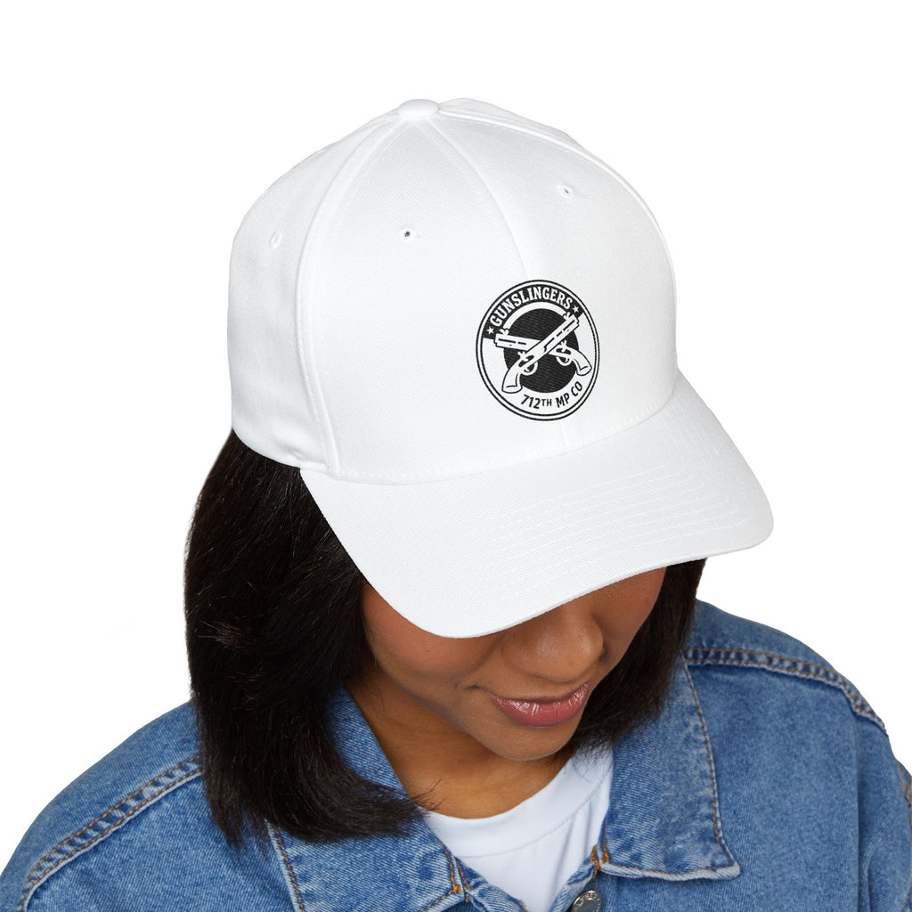 White embroidered baseball cap with circular emblem patch on front