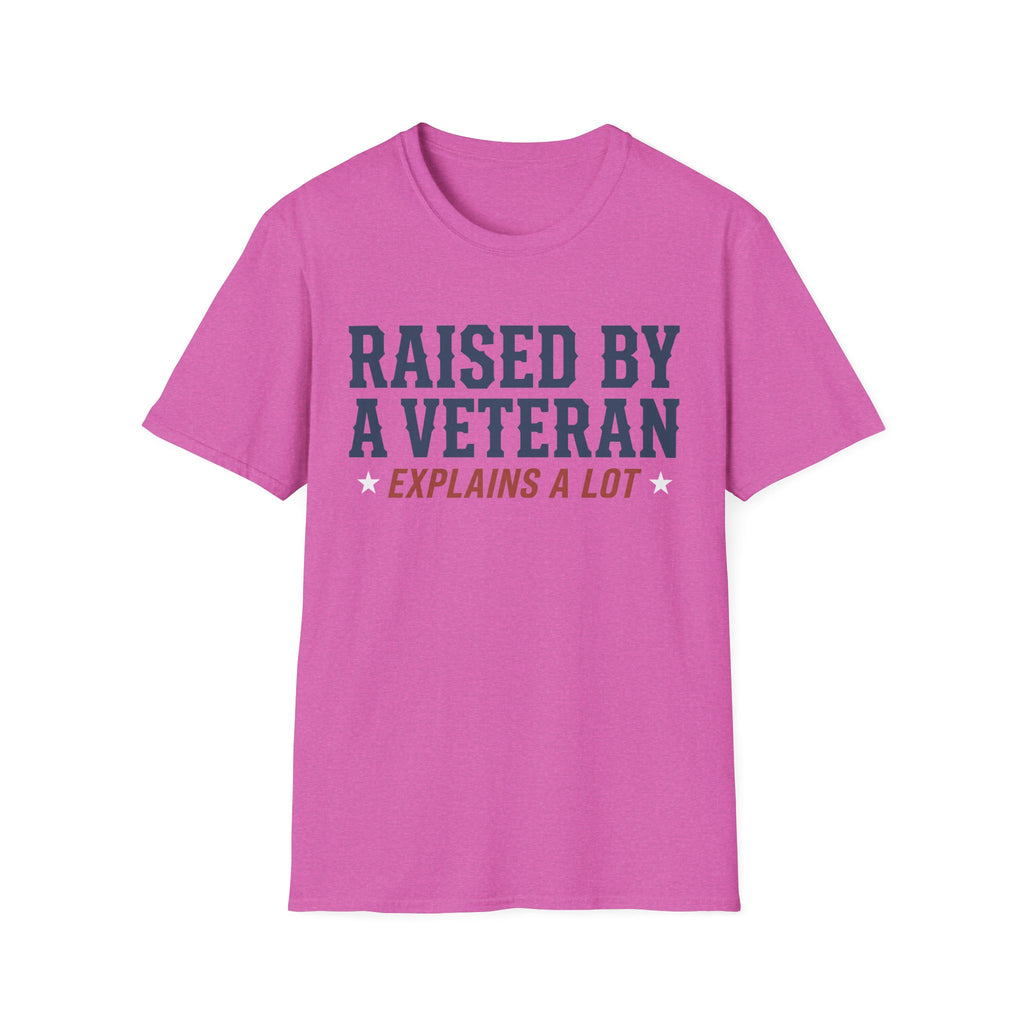 Pink crewneck T-shirt with 'RAISED BY A VETERAN' and 'EXPLAINS A LOT' graphic