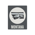 Montana state metal art sign with dark gray background, circle mountain graphic, and “MONTANA” text