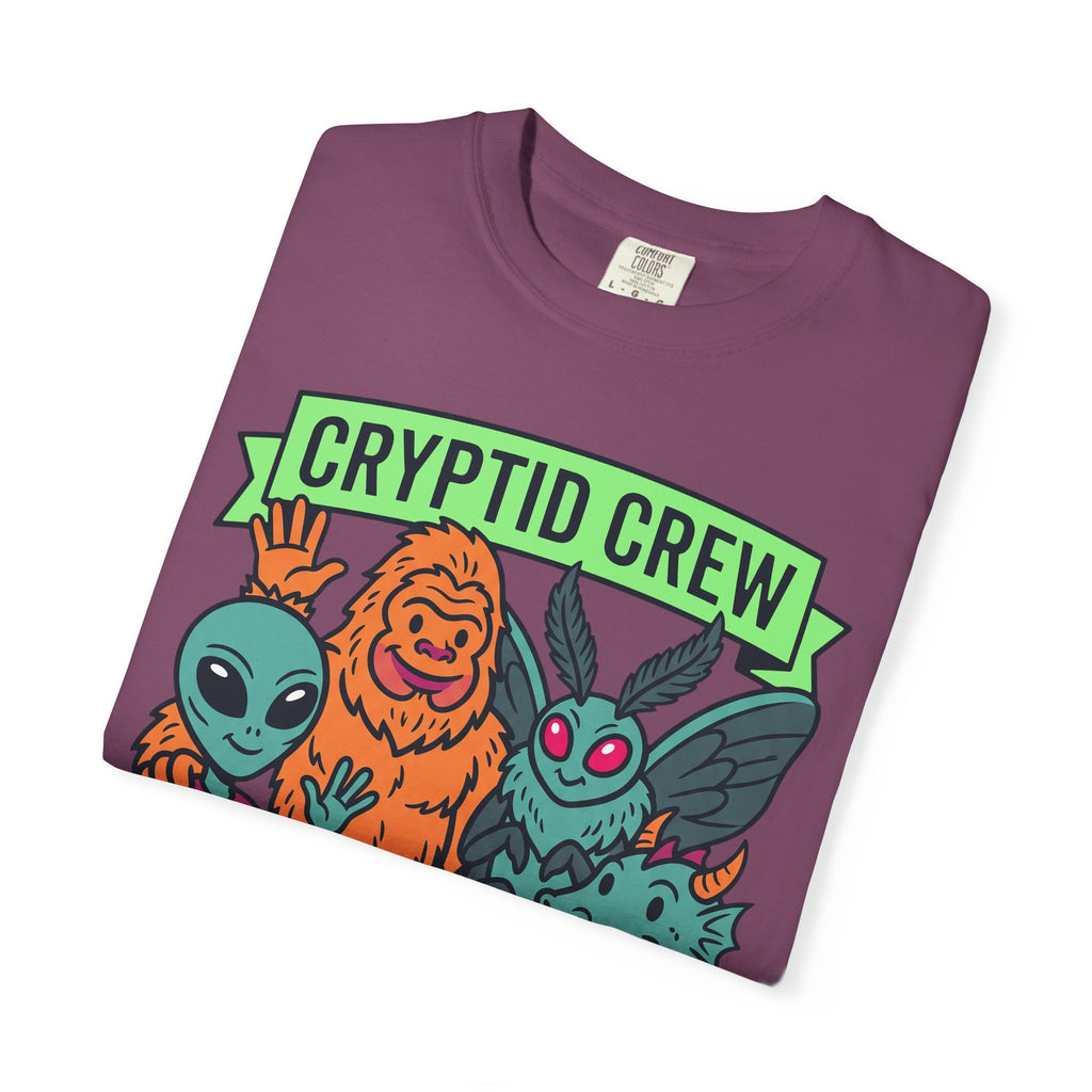 Plum crew neck t-shirt with folded multicolor cryptid graphic and 'CRYPTID CREW'