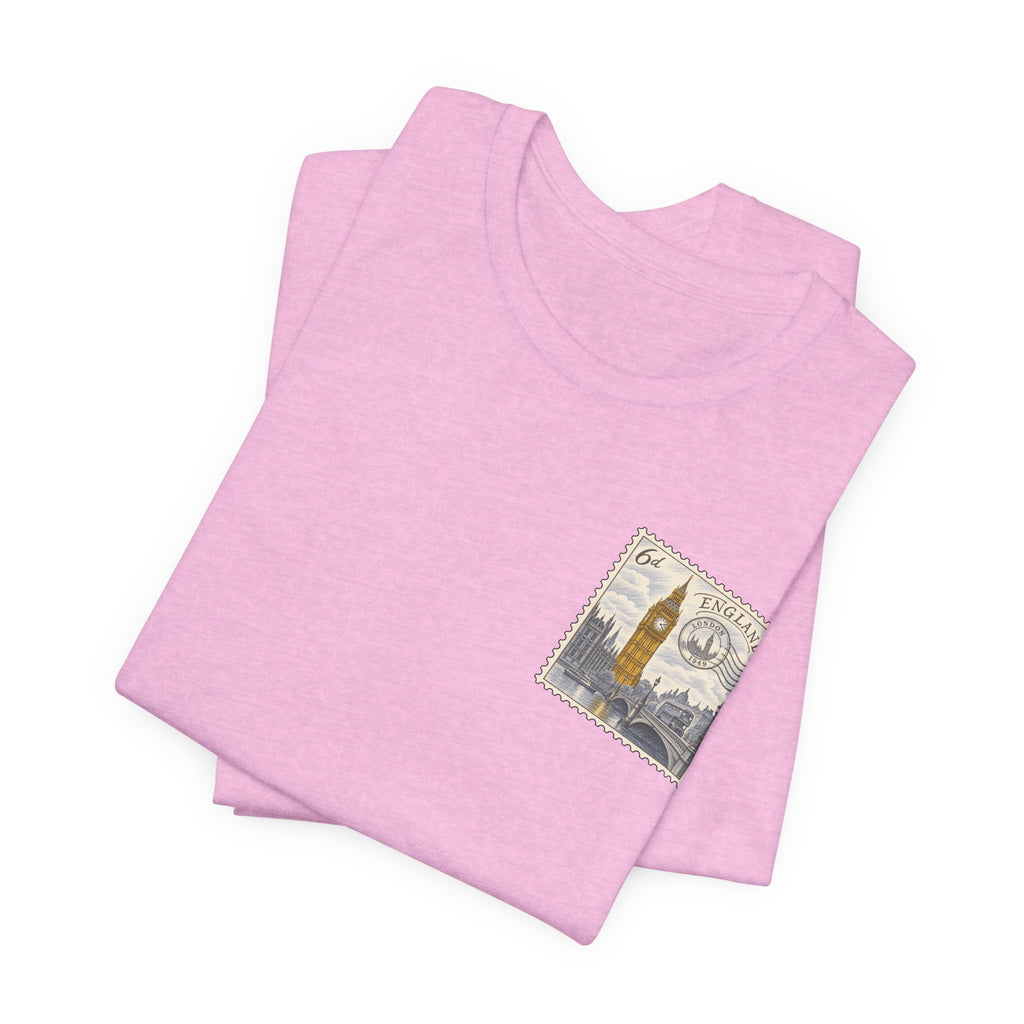 Light pink T-shirt with short sleeves and a vintage postage stamp graphic on the chest