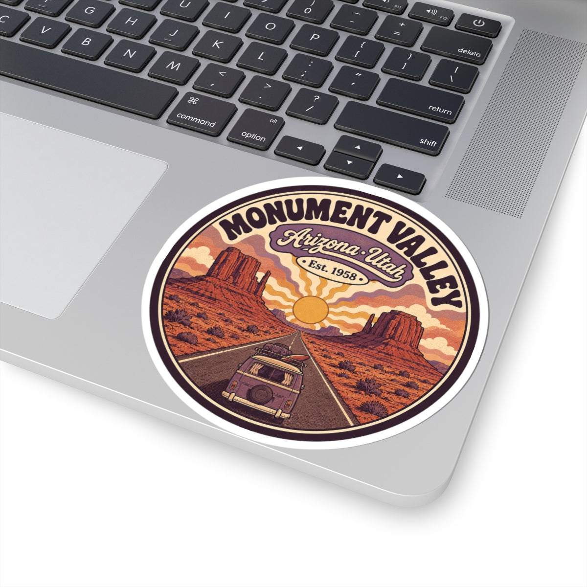 Round desert camper sticker with bold “MONUMENT VALLEY” text and Arizona-Utah banner