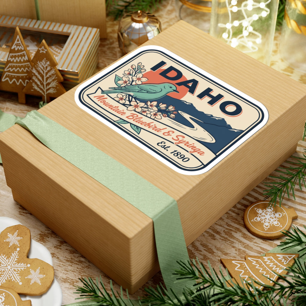 Idaho badge vinyl decal on gift box lid—IDAHO, bluebird, blossoms, Est. 1890