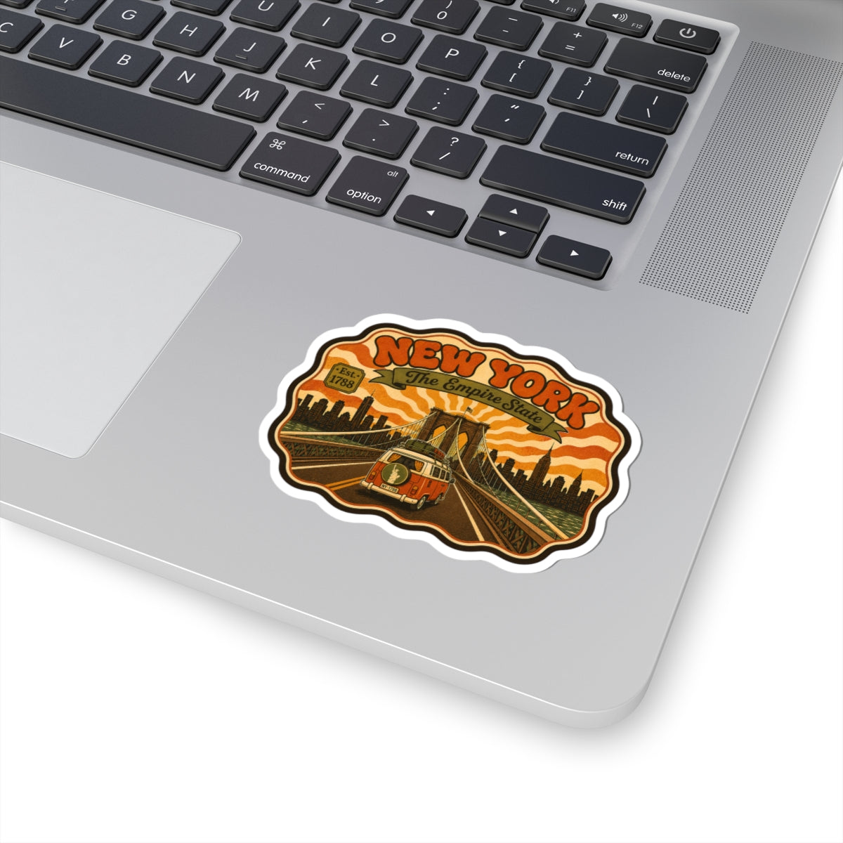 Kiss-cut vinyl sticker with 'NEW YORK' retro artwork and border outline in orange and brown.