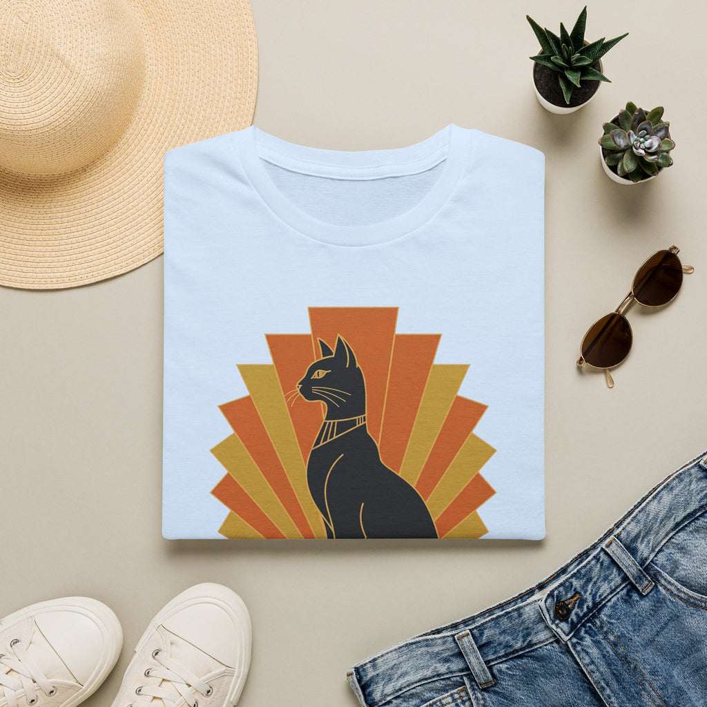 Light blue T-shirt with black Egyptian cat headdress, orange and yellow sunburst graphic.