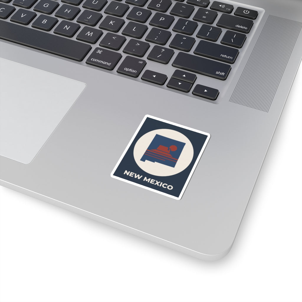 Kiss-cut square sticker with New Mexico outline and sunset graphic on laptop