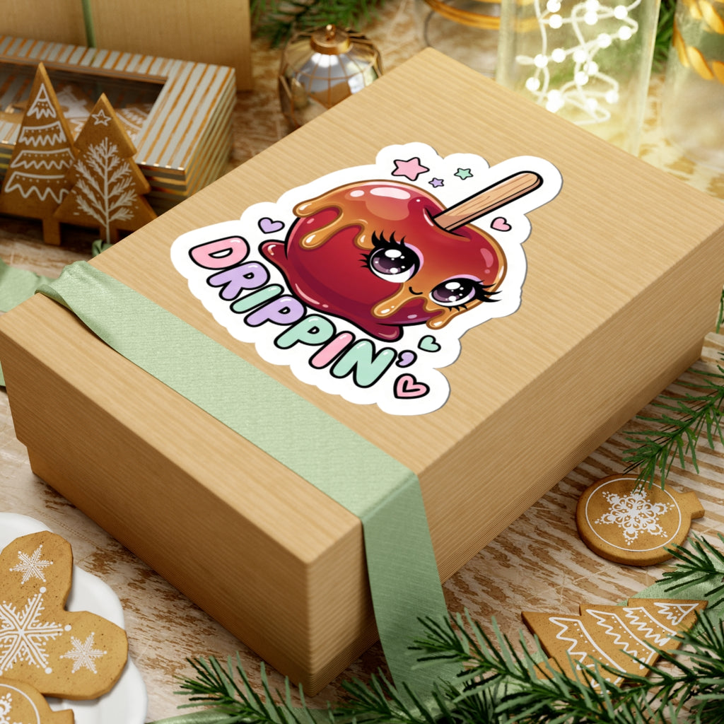 Kiss-cut sticker of a red candy apple character with "DRIPPIN'" on a wrapped gift