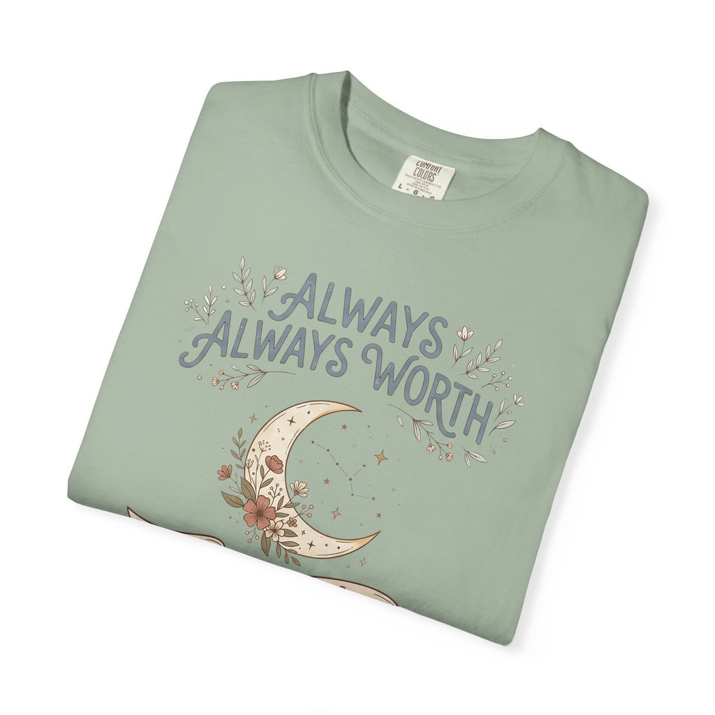 T-shirt in sage green with moon and “ALWAYS WORTH” floral text graphic on front.