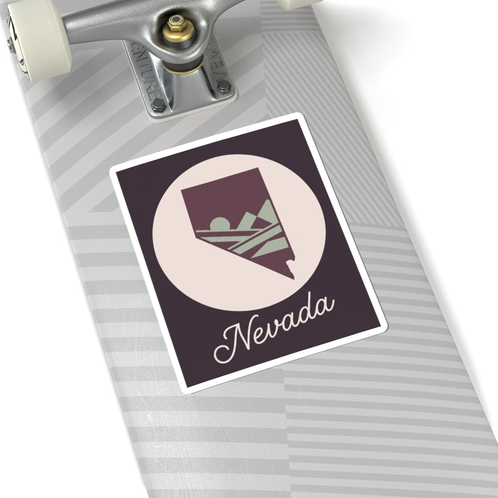 Nevada decal in square border with white circle, purple state silhouette and script 'Nevada'