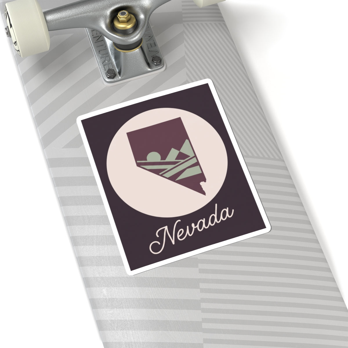 Nevada decal in square border with white circle, purple state silhouette and script 'Nevada'