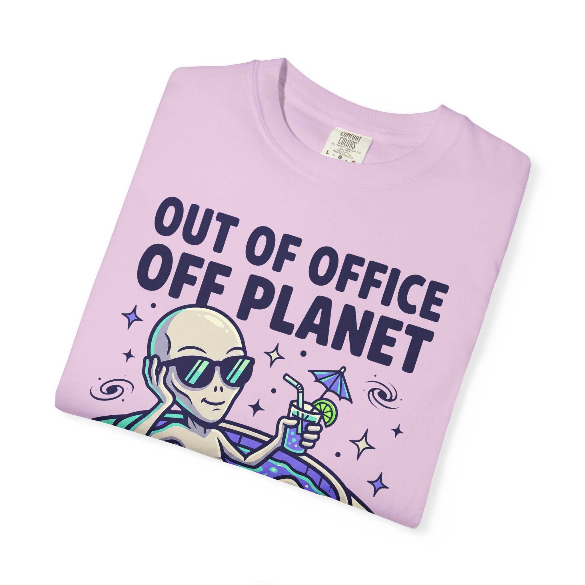 Light pink T-shirt with 'OUT OF OFFICE OFF PLANET' alien and UFO graphic