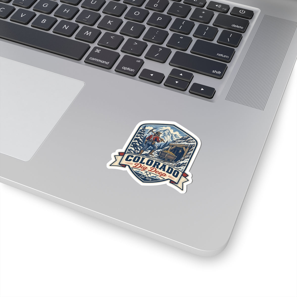 Colorado mining badge sticker with blue mountain scene, die-cut on white background