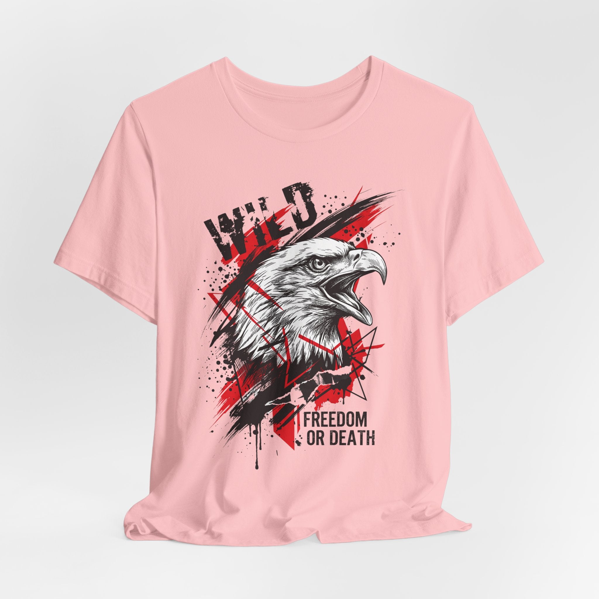 Pink T-shirt with centered eagle head graphic, splatter background, and slogan
