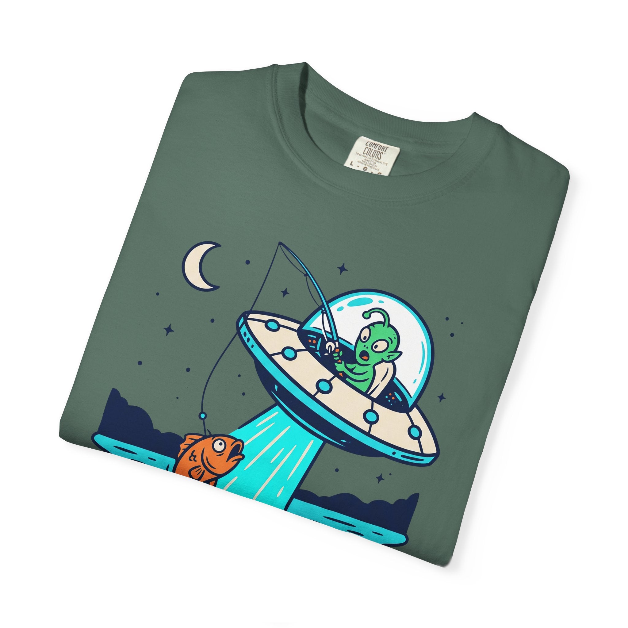 Dark green T-shirt with alien fishing UFO graphic and starry night scene.