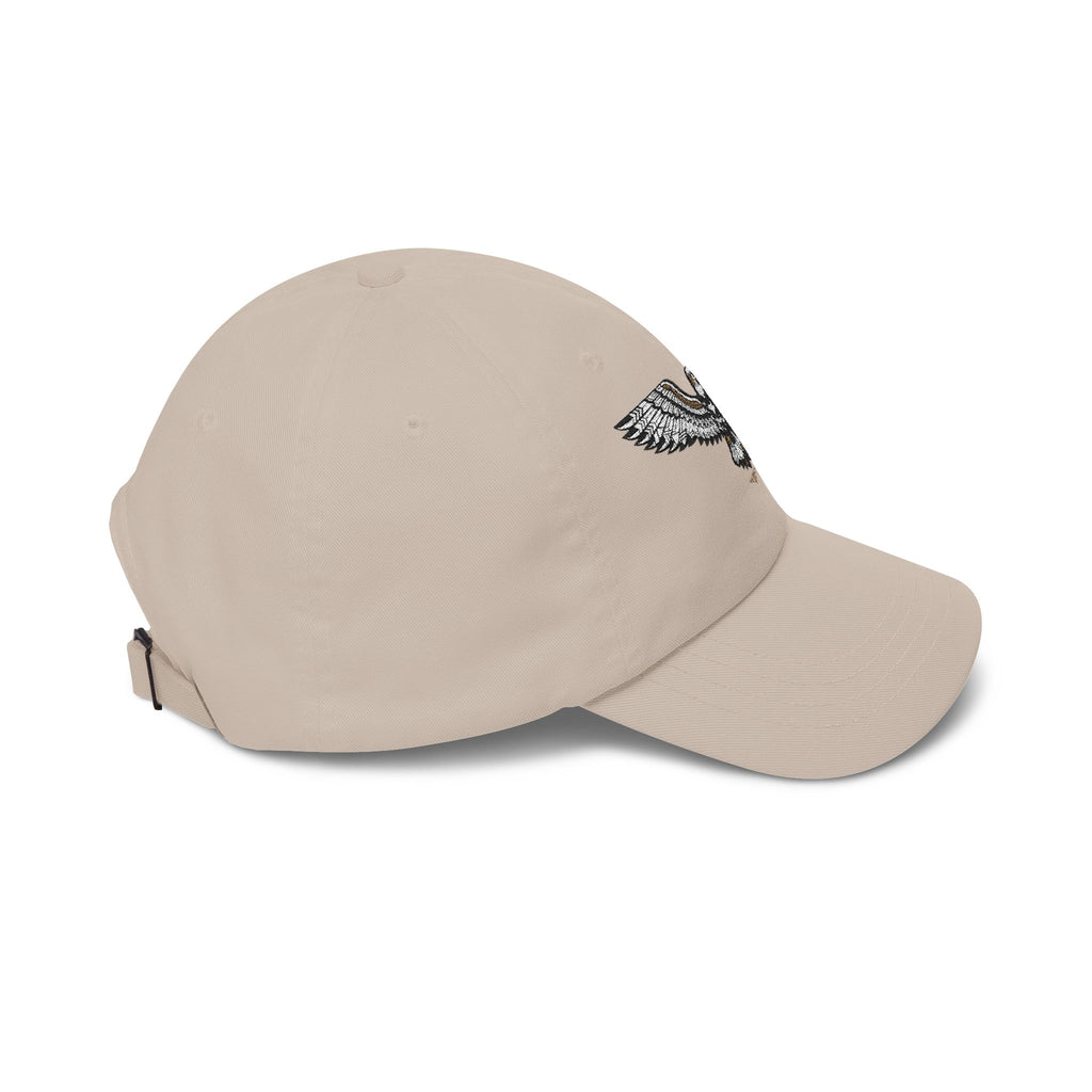 Tan baseball cap with embroidered eagle on the side and curved brim