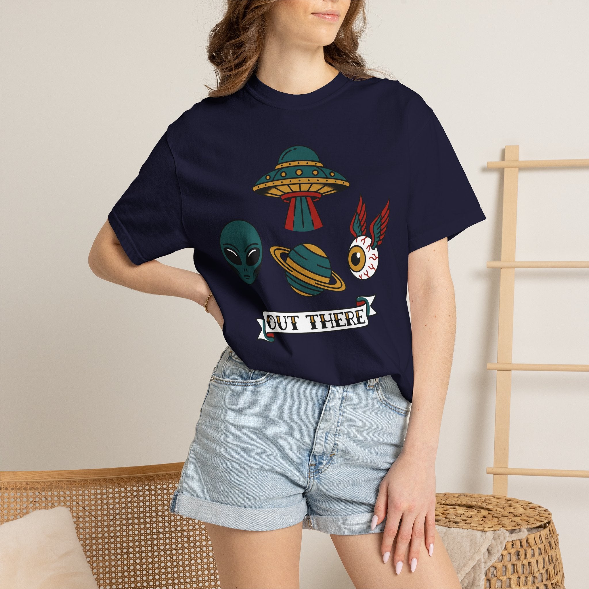 Navy T-shirt on model with alien, UFO and space-cat graphic and OUT THERE label