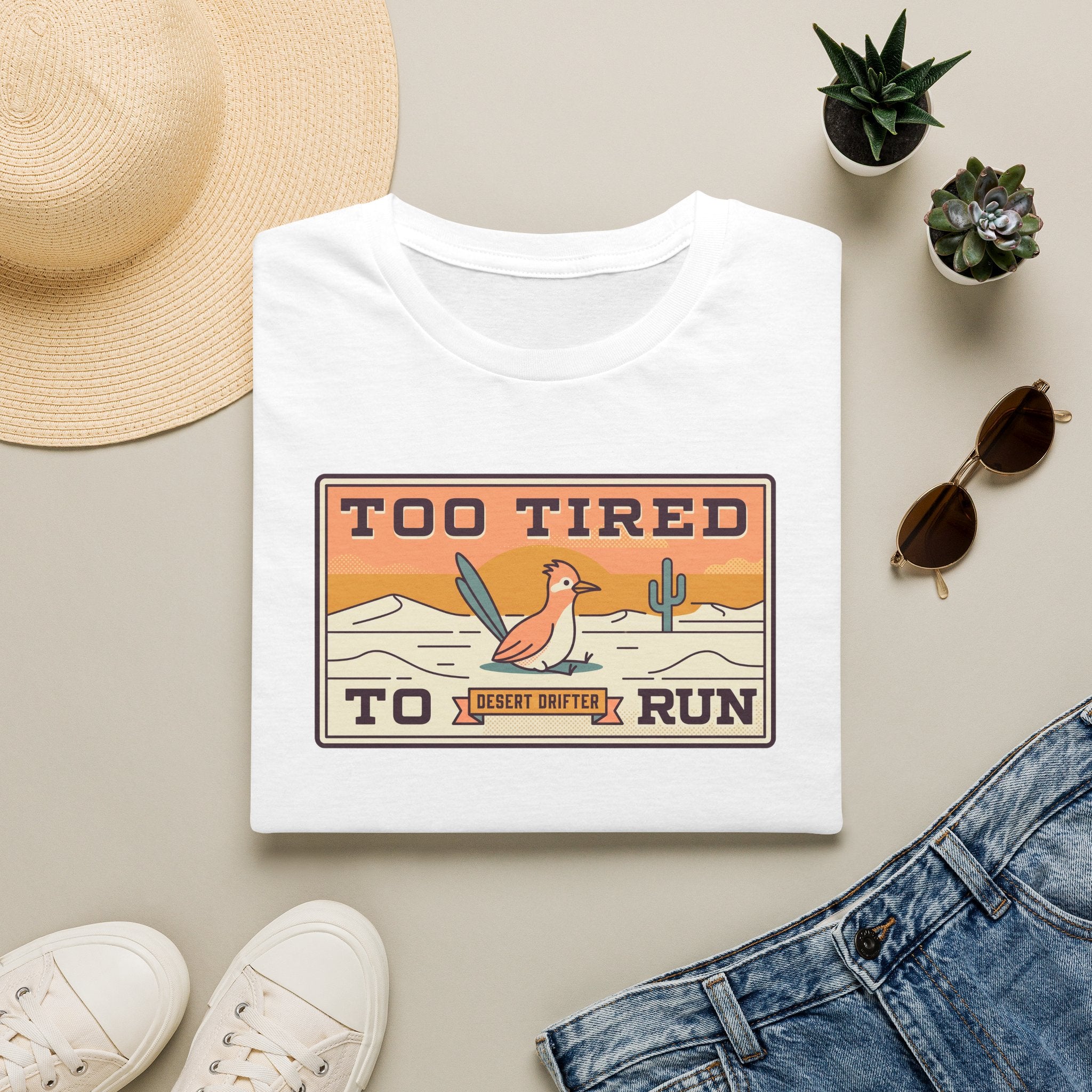 White crew-neck T-shirt with Too Tired To Run desert roadrunner graphic