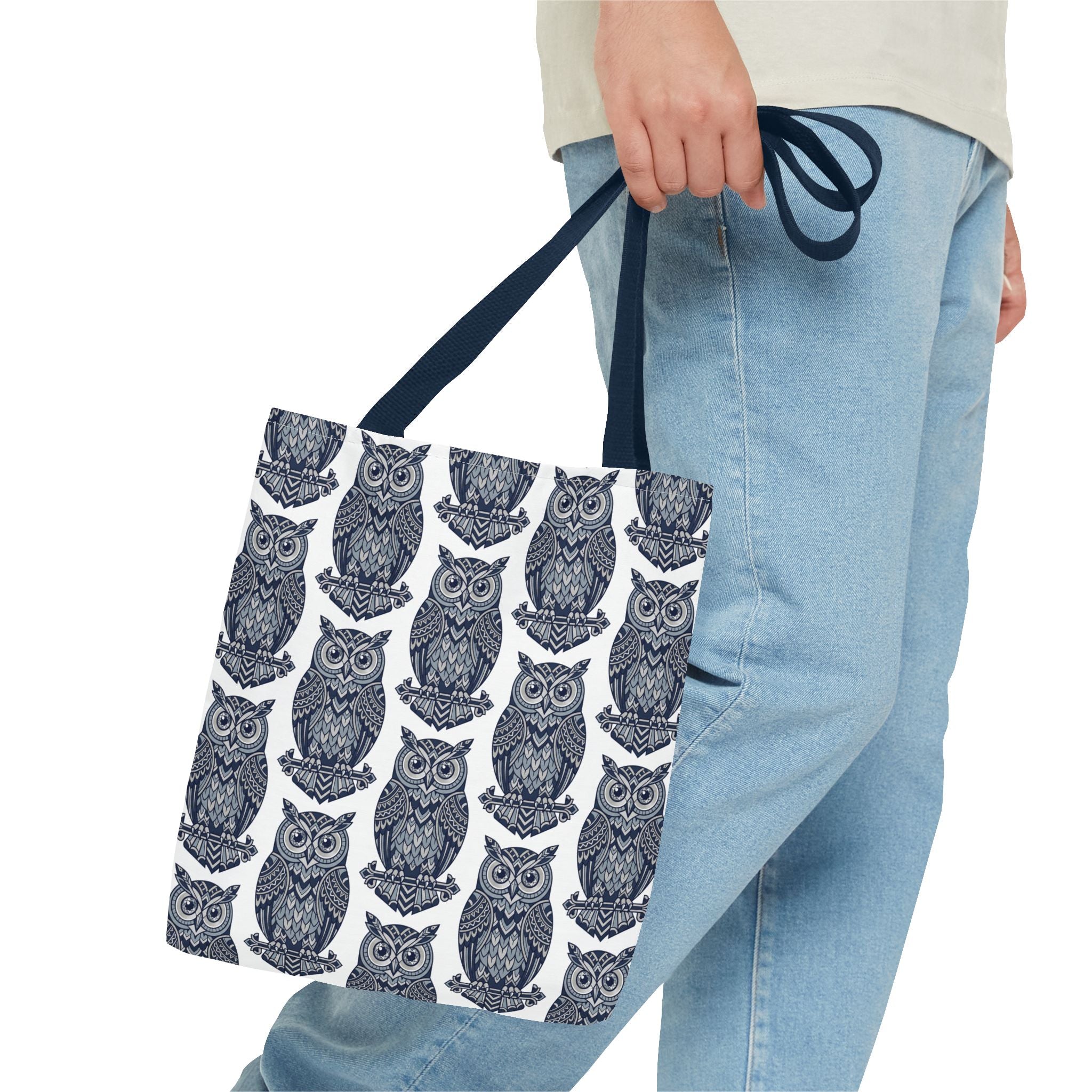 Tote bag with navy handles and repeating navy owl pattern, partial view