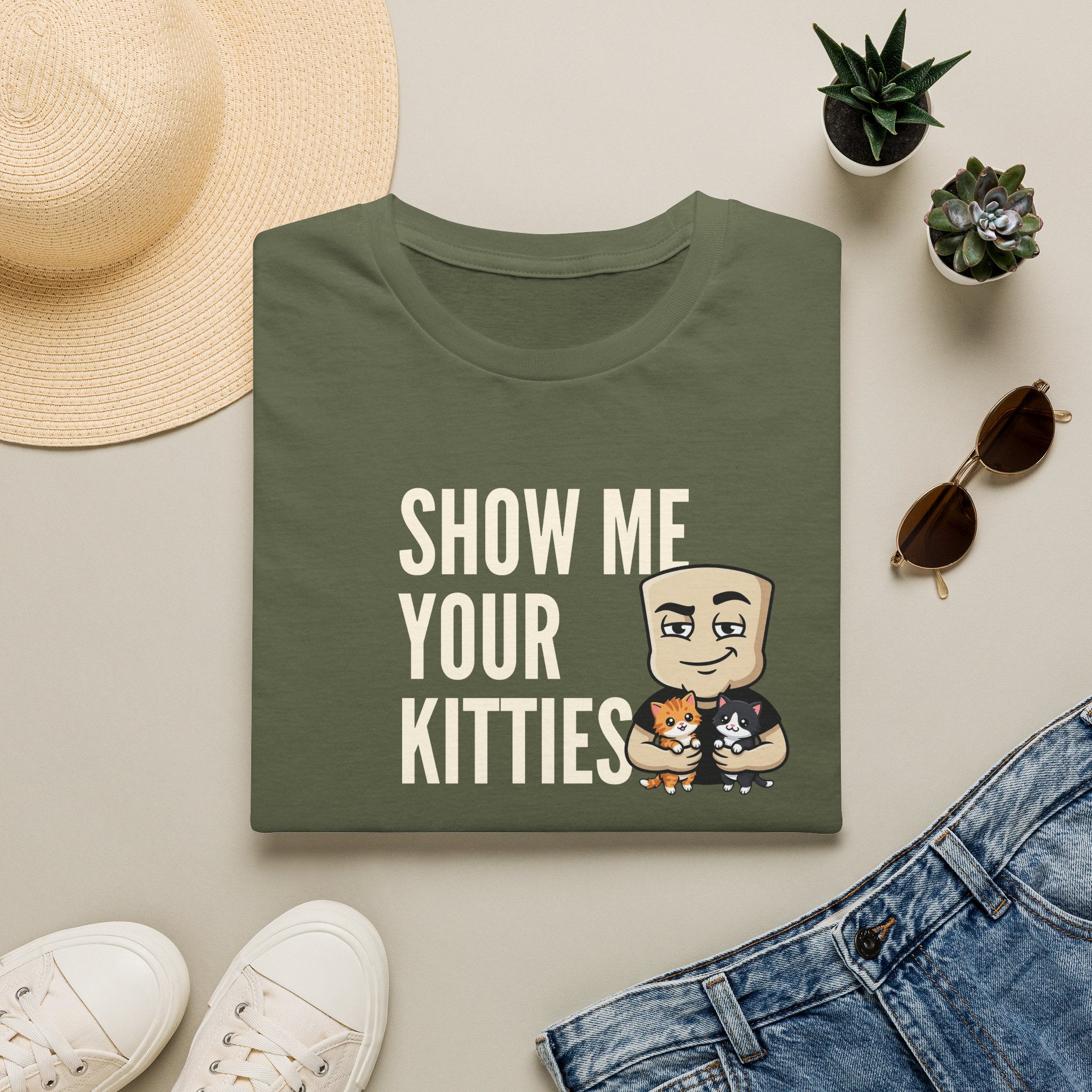 Green graphic t-shirt with text 'SHOW ME YOUR KITTIES' and cat illustration
