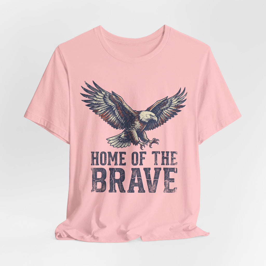 Soft pink crew-neck T-shirt with eagle and 'HOME OF THE BRAVE' text.