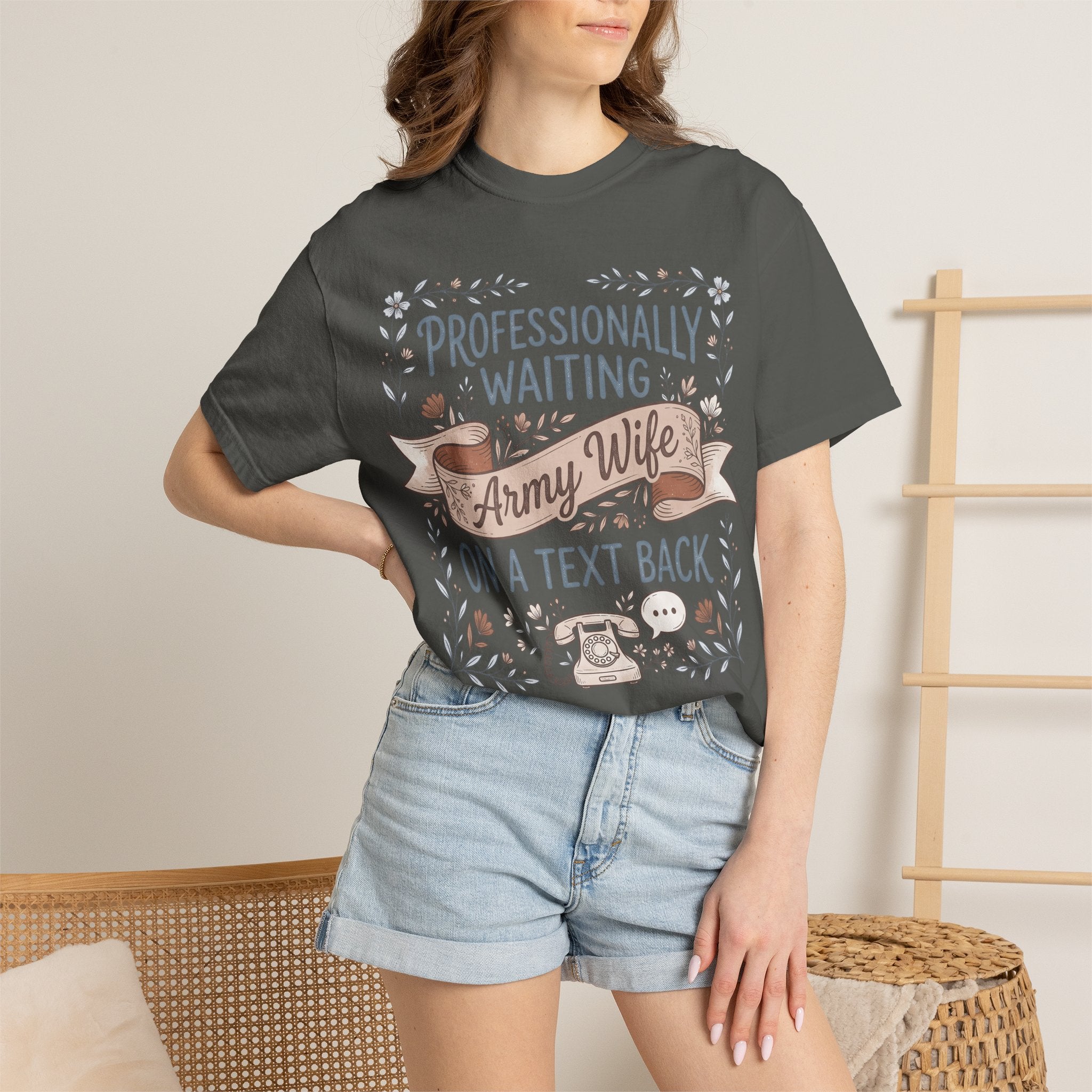 Charcoal t-shirt worn by model with floral ribbon 'Professionally Waiting Army Wife' graphic