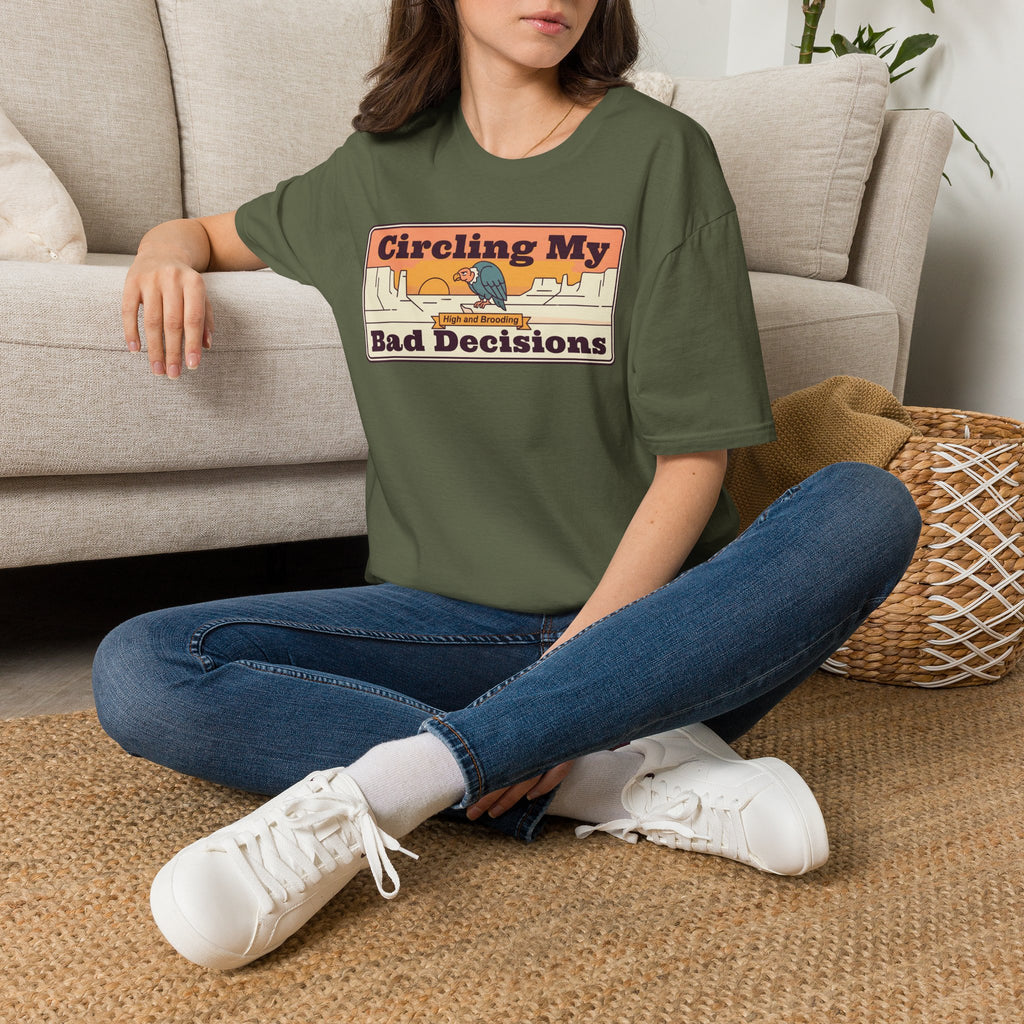 Olive green crewneck t-shirt with retro desert-style “Circling My Bad Decisions” graphic