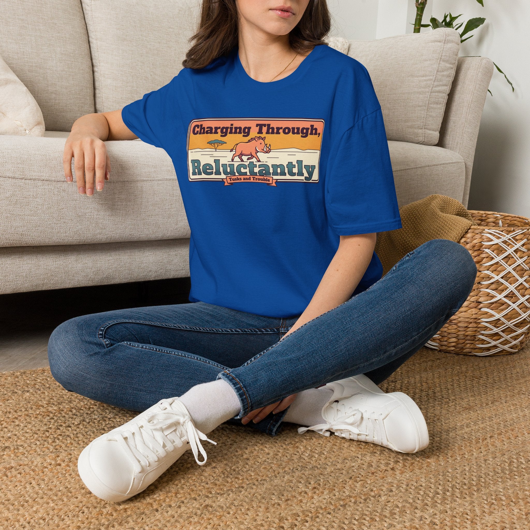 Royal blue crew-neck T-shirt with colorful “Charging Through Reluctantly” graphic print