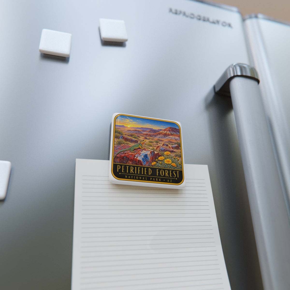 Square porcelain fridge magnet holding notes on a refrigerator door