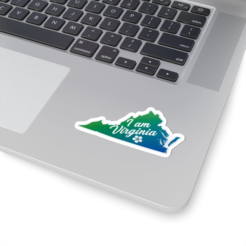I am Virginia sticker on laptop: green/blue Virginia map with white outline and flower