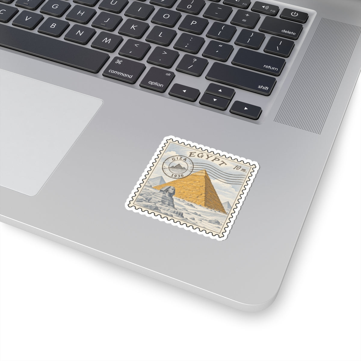 Egypt pyramid stamp decal with scalloped border on white laptop lid