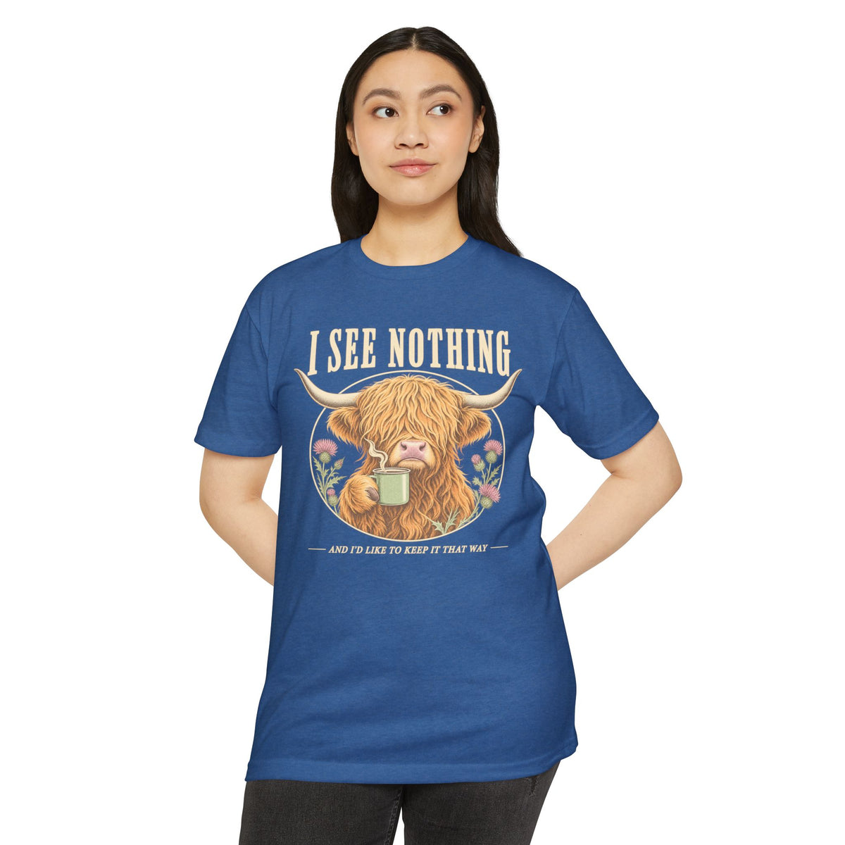 Blue crewneck T-shirt with Highland cow “I See Nothing” graphic