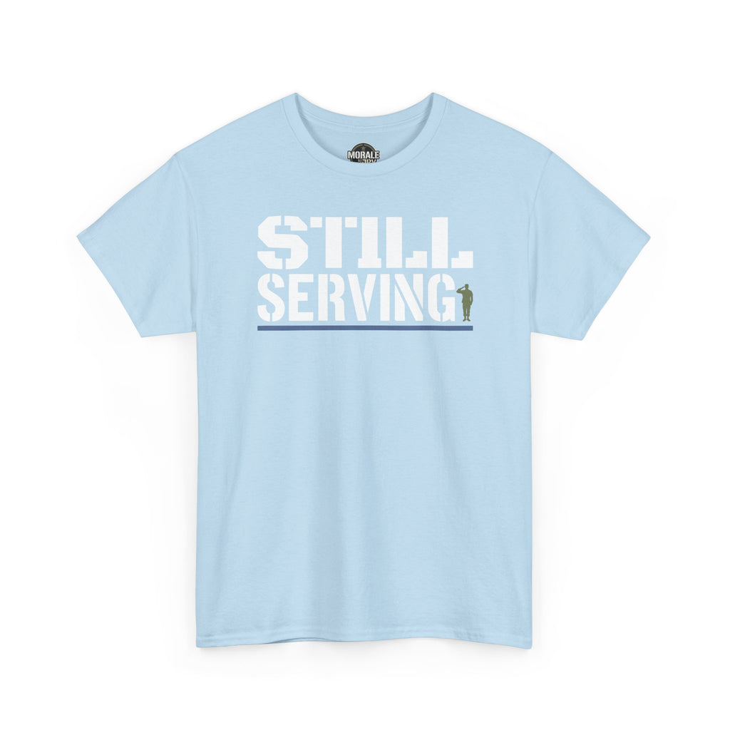 Light blue T-shirt with 'STILL SERVING' distressed white graphic, crew neck short sleeves.